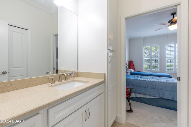 1124 Sea Shell Ct, Daytona Beach, FL 32124 - bathroom featuring ornamental molding, vanity, ensuite bath, and ceiling fan