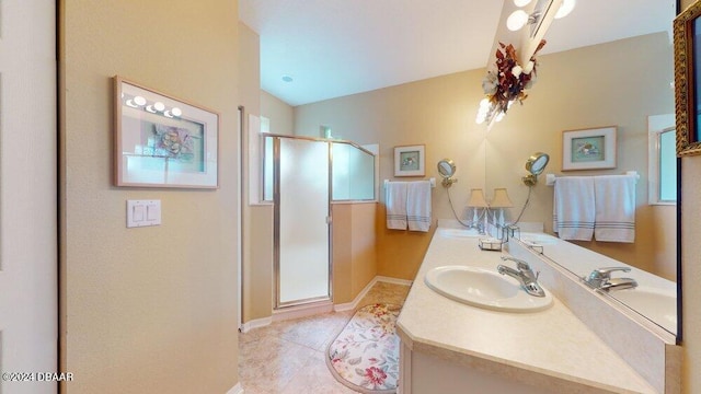 bathroom featuring tile patterned flooring, an enclosed shower, vanity, and vaulted ceiling