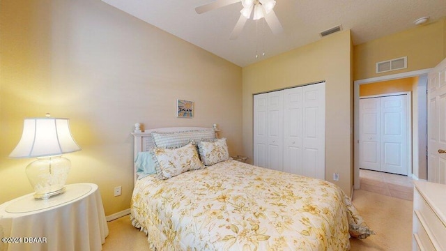 carpeted bedroom featuring ceiling fan, a closet, and vaulted ceiling