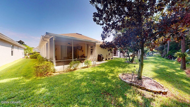 view of yard with a sunroom