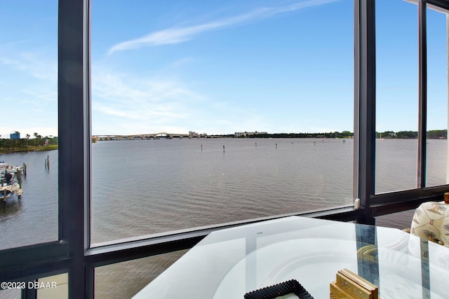 exterior space with a balcony and a water view