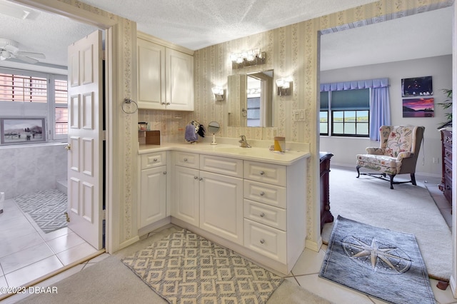 731 Marina Point Dr Unit 7310, Daytona Beach, FL 32114 - bathroom featuring a textured ceiling, wallpapered walls, vanity, a ceiling fan, and tile patterned floors