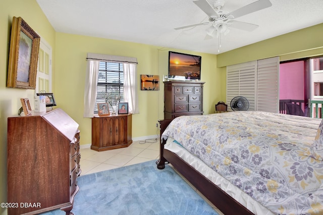 bedroom with light tile patterned floors and ceiling fan