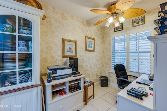 tiled home office featuring ceiling fan