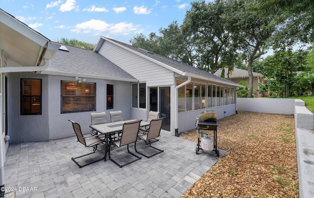 4791 S Peninsula Dr, Ponce Inlet, FL 32127 - view of patio with a sunroom, area for grilling, and outdoor dining space