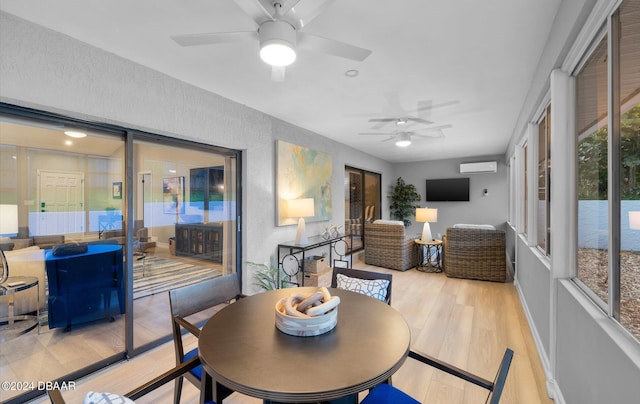 4791 S Peninsula Dr, Ponce Inlet, FL 32127 - sunroom featuring a wall unit AC, a ceiling fan, outdoor dining space, and wood finished floors