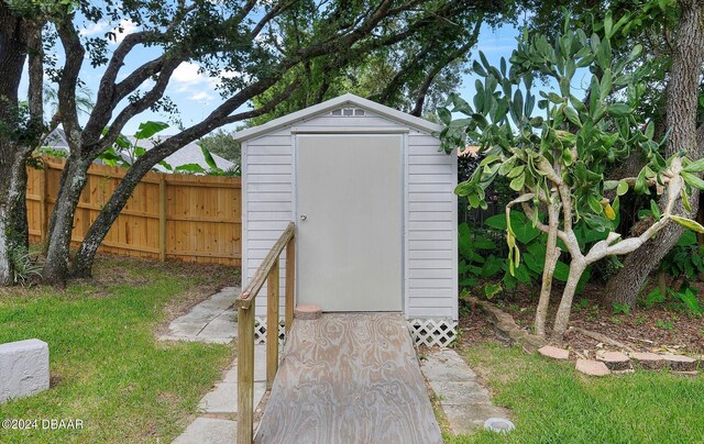 4791 S Peninsula Dr, Ponce Inlet, FL 32127 - view of shed featuring fence