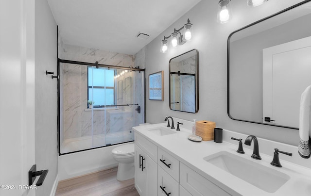 4791 S Peninsula Dr, Ponce Inlet, FL 32127 - full bath featuring a sink, enclosed tub / shower combo, toilet, and wood finished floors