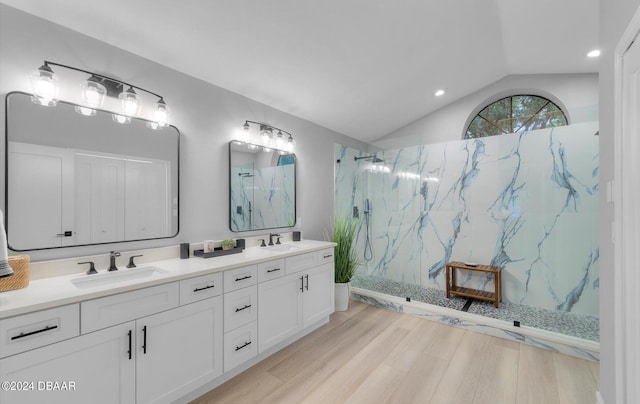 4791 S Peninsula Dr, Ponce Inlet, FL 32127 - full bathroom featuring a marble finish shower, a sink, lofted ceiling, and wood finished floors