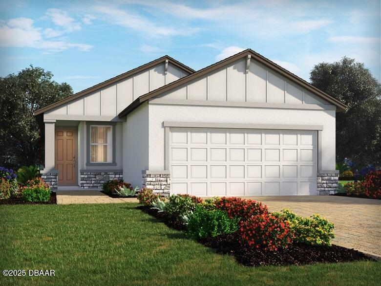 view of front of house featuring a garage, stone siding, a front lawn, and board and batten siding