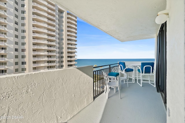 balcony featuring a water view