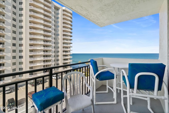 balcony featuring a water view