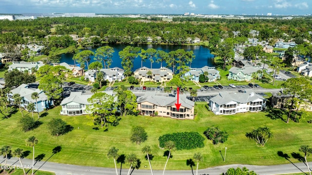 birds eye view of property with a water view