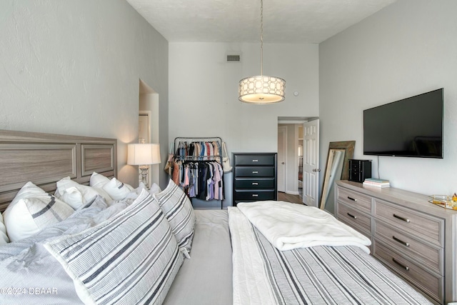 bedroom with a high ceiling