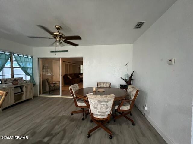 806 E 2nd Ave, New Smyrna Beach, FL 32169 - dining area with wood finished floors and ceiling fan