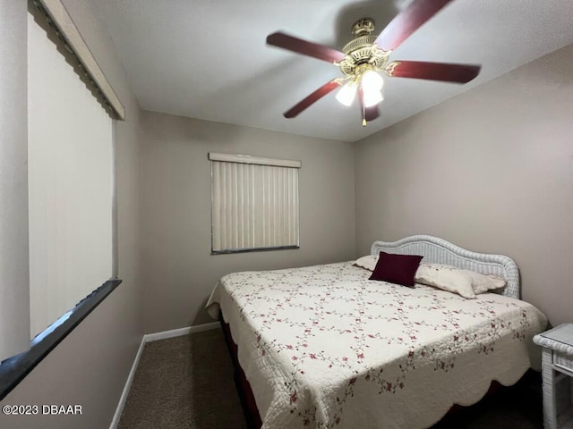 806 E 2nd Ave, New Smyrna Beach, FL 32169 - carpeted bedroom with baseboards and a ceiling fan