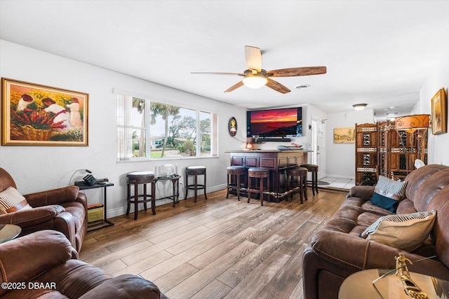 153 University Cir, Ormond Beach, FL 32176 - living area featuring a ceiling fan and wood finished floors