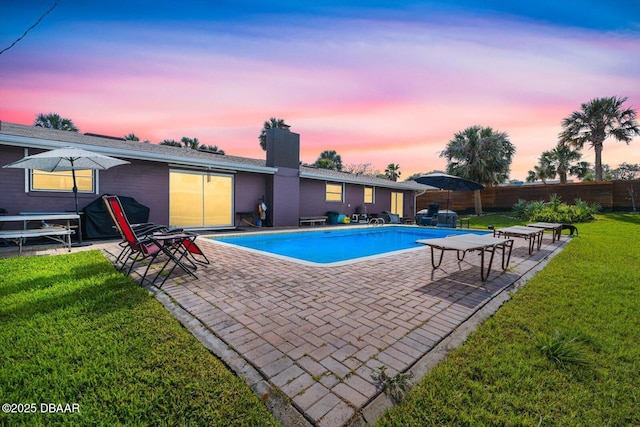 153 University Cir, Ormond Beach, FL 32176 - pool at dusk featuring a patio