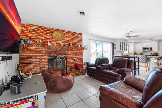 153 University Cir, Ormond Beach, FL 32176 - living area with light tile patterned flooring, ceiling fan, and a fireplace