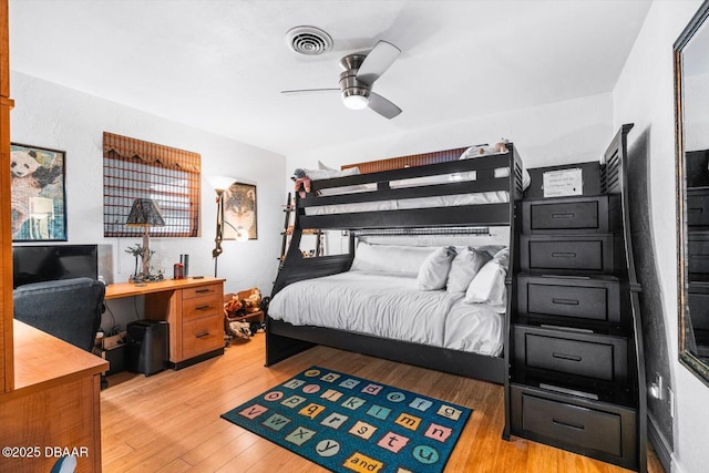 153 University Cir, Ormond Beach, FL 32176 - bedroom featuring wood finished floors, an office area, and ceiling fan
