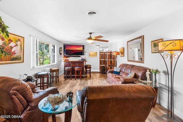 153 University Cir, Ormond Beach, FL 32176 - living area with ceiling fan and hardwood / wood-style flooring