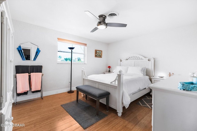 153 University Cir, Ormond Beach, FL 32176 - bedroom with light wood-type flooring and ceiling fan