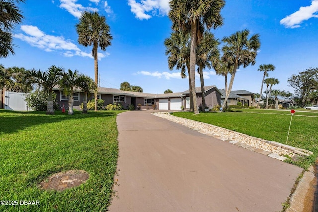 153 University Cir, Ormond Beach, FL 32176 - ranch-style house featuring a garage and driveway