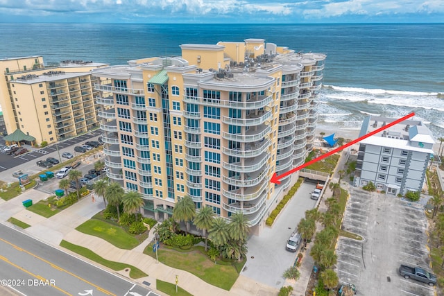 bird's eye view featuring a view of the beach and a water view