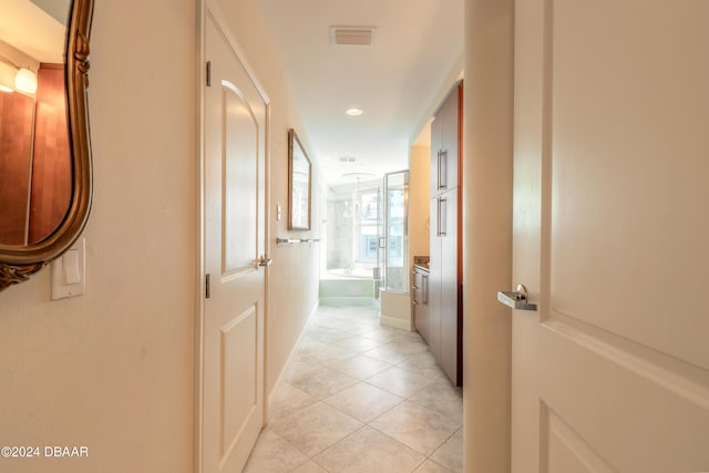 hallway with light tile patterned floors