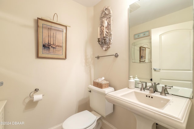 bathroom with toilet and sink