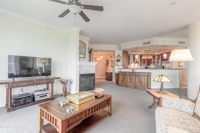 living room featuring light carpet, ceiling fan, and crown molding