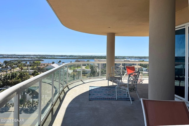 balcony featuring a water view