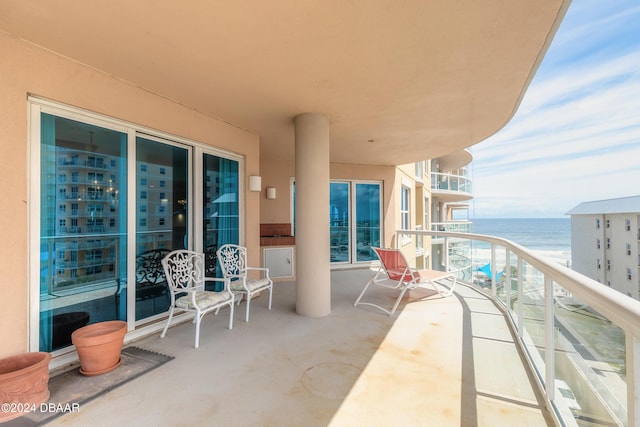 balcony featuring a water view