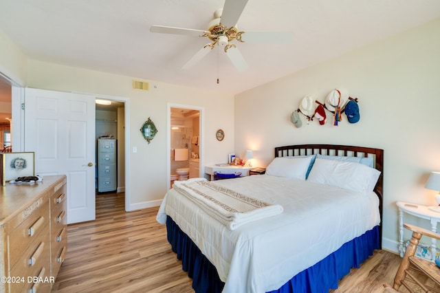 bedroom with connected bathroom, light hardwood / wood-style floors, and ceiling fan