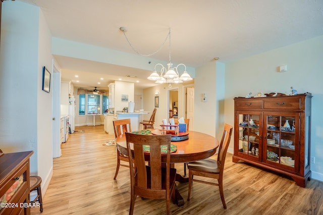 dining space featuring a chandelier and light hardwood / wood-style floors