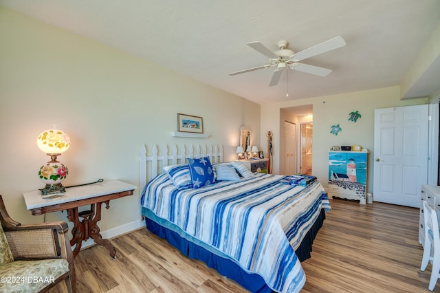 bedroom with wood-type flooring and ceiling fan