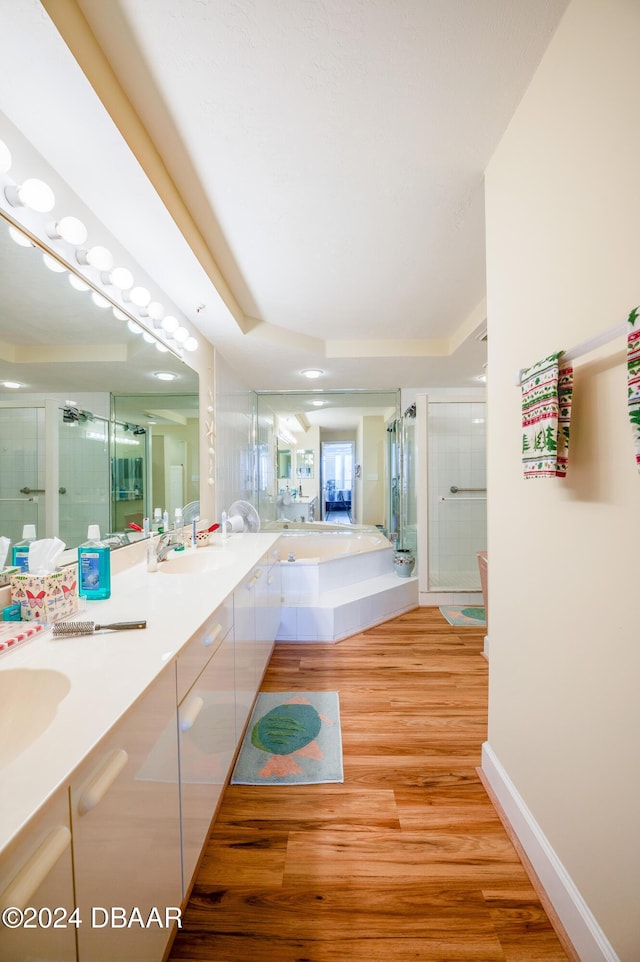 corridor with light hardwood / wood-style floors and sink