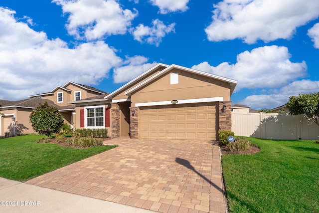 view of front facade with a garage and a front lawn