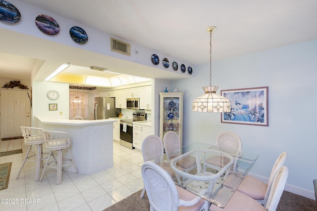 4555 S Atlantic Ave Unit 4310, Ponce Inlet, FL 32127 - dining space with light tile patterned flooring