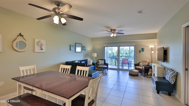 dining space with ceiling fan and light tile patterned floors