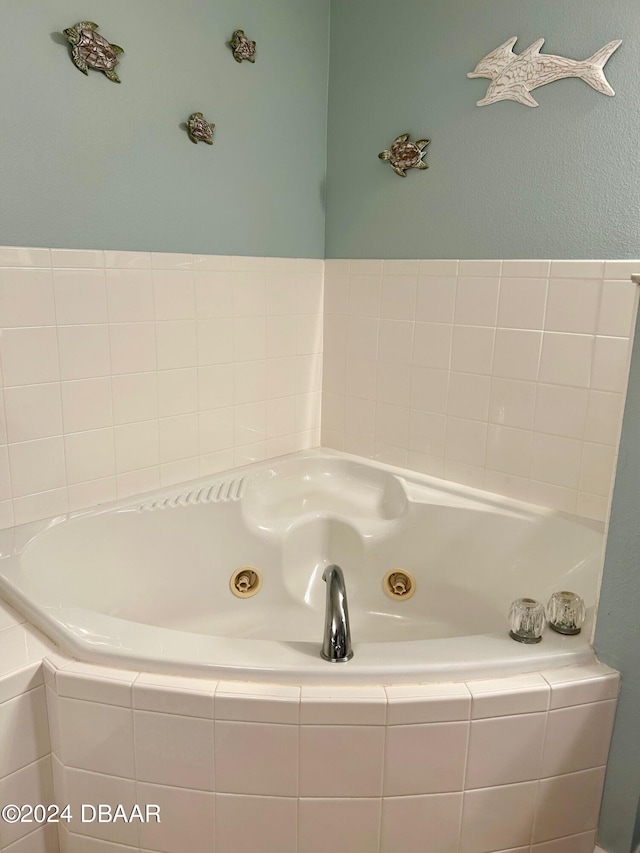 bathroom featuring tiled bath