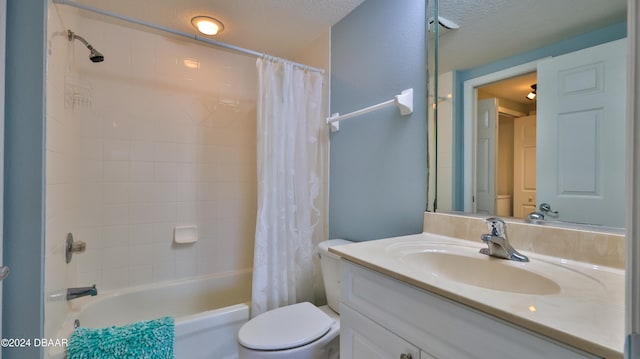 full bathroom featuring vanity, a textured ceiling, shower / bathtub combination with curtain, and toilet