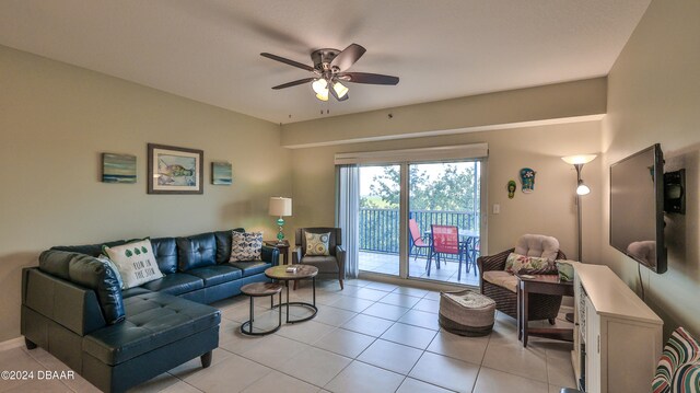 living room featuring light tile patterned flooring and ceiling fan