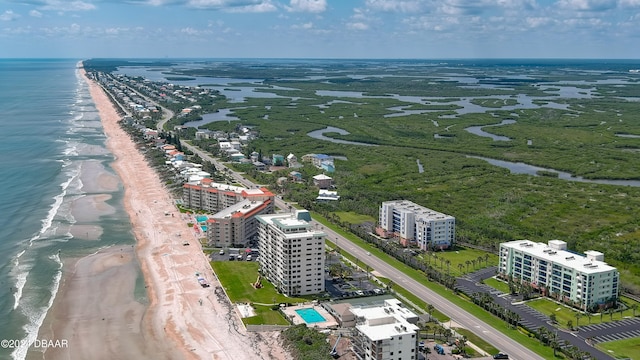 aerial view featuring a view of the beach and a water view