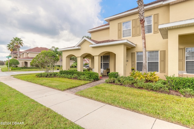 view of front of home with a front lawn