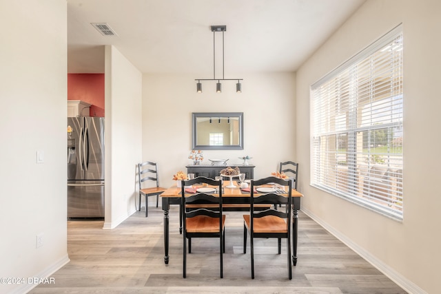 dining room with light wood-type flooring