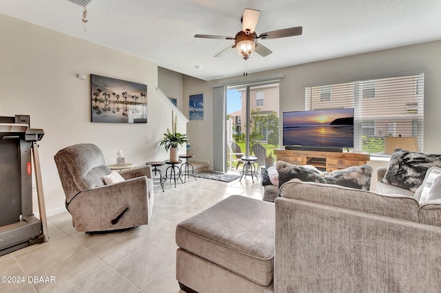 living room with light tile patterned floors and ceiling fan