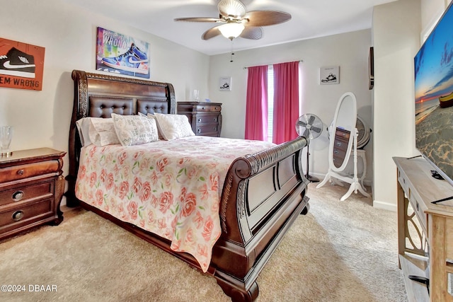 bedroom with ceiling fan and light carpet