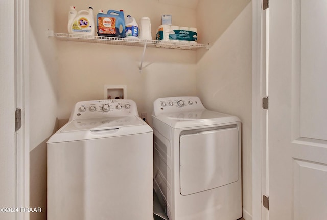 washroom with washing machine and dryer