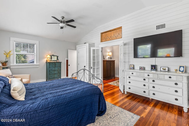 509 Faulkner St, New Smyrna Beach, FL 32168 - bedroom featuring ensuite bath, ceiling fan, dark hardwood / wood-style floors, and vaulted ceiling